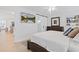 Main bedroom with king bed, ensuite bathroom, and walk-in closet at 203 S Spring Blvd, Tarpon Springs, FL 34689