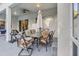 Covered patio with seating area, table, and umbrella, adjacent to the house at 2533 Wood Pointe Dr, Holiday, FL 34691