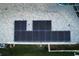 Aerial view showing home with solar panels and pool at 2533 Wood Pointe Dr, Holiday, FL 34691