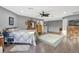 Spacious main bedroom with wood floors and ceiling fan at 2533 Wood Pointe Dr, Holiday, FL 34691