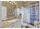 Bathroom with double vanity and shower at 2533 Wood Pointe Dr, Holiday, FL 34691