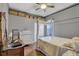 Bedroom with a canopy bed and built-in shelving at 2533 Wood Pointe Dr, Holiday, FL 34691