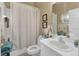 Bathroom with shower/tub combo and white vanity at 2533 Wood Pointe Dr, Holiday, FL 34691