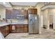 Modern kitchen with stainless steel appliances and dark wood cabinets at 2533 Wood Pointe Dr, Holiday, FL 34691