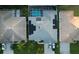 Aerial view of house with solar panels and pool at 2533 Wood Pointe Dr, Holiday, FL 34691