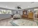 Bright main bedroom featuring wood floors and large windows at 2533 Wood Pointe Dr, Holiday, FL 34691