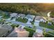 Aerial view of houses on a tree-lined street at 2533 Wood Pointe Dr, Holiday, FL 34691