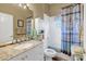 Clean bathroom with granite countertop, bathtub, and shower at 2533 Wood Pointe Dr, Holiday, FL 34691