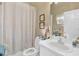 Bathroom with shower/tub combo and white vanity at 2533 Wood Pointe Dr, Holiday, FL 34691