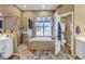 Spacious bathroom with soaking tub, shower, and double vanity at 2533 Wood Pointe Dr, Holiday, FL 34691