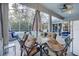 Patio furniture near pool with screened enclosure at 2533 Wood Pointe Dr, Holiday, FL 34691