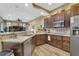 Well-equipped kitchen featuring stainless steel appliances and ample cabinetry at 2533 Wood Pointe Dr, Holiday, FL 34691