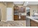 Modern kitchen with stainless steel appliances and dark wood cabinetry at 2533 Wood Pointe Dr, Holiday, FL 34691