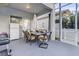 Covered patio with outdoor dining furniture and mini-fridge at 2533 Wood Pointe Dr, Holiday, FL 34691