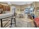 Eat-in kitchen with a table and chairs near a bright window at 2533 Wood Pointe Dr, Holiday, FL 34691