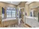 Spacious bathroom with soaking tub, shower, and double vanity at 2533 Wood Pointe Dr, Holiday, FL 34691