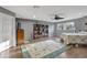 Main bedroom with wood floors, ceiling fan and built-in shelving at 2533 Wood Pointe Dr, Holiday, FL 34691