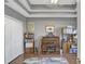 Home office with built-in bookcases and desk at 2533 Wood Pointe Dr, Holiday, FL 34691