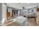 Main bedroom with wood floors, ceiling fan, and large windows at 2533 Wood Pointe Dr, Holiday, FL 34691