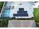 Aerial view of house with solar panels and pool at 2533 Wood Pointe Dr, Holiday, FL 34691