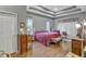 Large main bedroom with hardwood floors and coffered ceiling at 2533 Wood Pointe Dr, Holiday, FL 34691