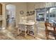 Charming kitchen nook with a small table and chairs by a window at 2533 Wood Pointe Dr, Holiday, FL 34691
