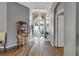 Elegant entryway with hardwood floors and a chandelier, leading to the living spaces at 2533 Wood Pointe Dr, Holiday, FL 34691