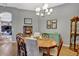A formal dining room features a wooden table and various decorative items at 2533 Wood Pointe Dr, Holiday, FL 34691