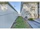 Landscaped backyard with fence and pool equipment at 2533 Wood Pointe Dr, Holiday, FL 34691