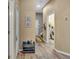 Hallway leading to bedrooms, laundry room, and upstairs at 2533 Wood Pointe Dr, Holiday, FL 34691