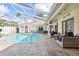 Stunning view of the pool and spacious patio area at 3527 Conifer Loop, Spring Hill, FL 34609
