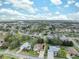 Aerial view of a residential neighborhood featuring numerous homes with lush landscaping at 3527 Conifer Loop, Spring Hill, FL 34609