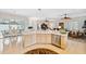 Open concept kitchen with island, stainless steel appliances, and views of the pool at 3527 Conifer Loop, Spring Hill, FL 34609