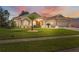Beautiful one-story home with palm trees and well-maintained lawn at 3527 Conifer Loop, Spring Hill, FL 34609