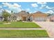 Stunning one-story house with a lush green lawn and driveway at 3527 Conifer Loop, Spring Hill, FL 34609