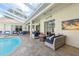 Relaxing patio with fire pit and comfortable seating at 3527 Conifer Loop, Spring Hill, FL 34609