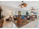 Spacious living room with leather sectional and wood accents at 3527 Conifer Loop, Spring Hill, FL 34609