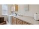 Convenient laundry room with washer, dryer, and cabinets at 3527 Conifer Loop, Spring Hill, FL 34609