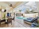 Dine alfresco by the pool in this covered patio at 3527 Conifer Loop, Spring Hill, FL 34609