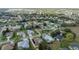 Aerial view of a residential area, showing a variety of house styles and landscaping at 3527 Conifer Loop, Spring Hill, FL 34609