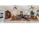 Spacious living room featuring a large sectional sofa and decorative accents at 3527 Conifer Loop, Spring Hill, FL 34609
