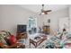Bright bonus room with wet bar, comfortable seating, and backyard views at 3527 Conifer Loop, Spring Hill, FL 34609