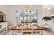 Bright dining room with a view of the pool through sliding glass doors at 3527 Conifer Loop, Spring Hill, FL 34609