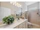 Clean bathroom with updated vanity, shower, and plenty of storage at 3527 Conifer Loop, Spring Hill, FL 34609