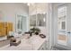Bathroom with vanity, large mirror and pool access at 3527 Conifer Loop, Spring Hill, FL 34609