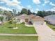 One-story house with a large yard, pool, and double garage at 3527 Conifer Loop, Spring Hill, FL 34609