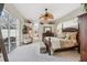 Spacious Primary bedroom with king-size bed and private access to pool area at 3527 Conifer Loop, Spring Hill, FL 34609