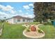 Well-maintained backyard with lush lawn and decorative landscaping at 3527 Conifer Loop, Spring Hill, FL 34609