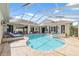 Spacious pool and spa with covered patio area at 3527 Conifer Loop, Spring Hill, FL 34609