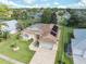 One-story house with solar panels, a large yard, and a pool with a glass enclosure at 3527 Conifer Loop, Spring Hill, FL 34609